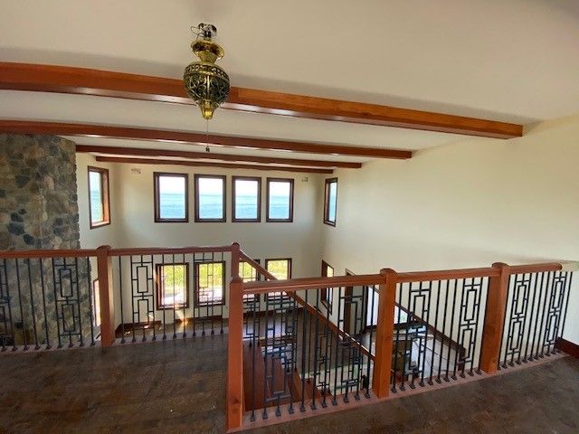 Redwood plank stair with metal balusters